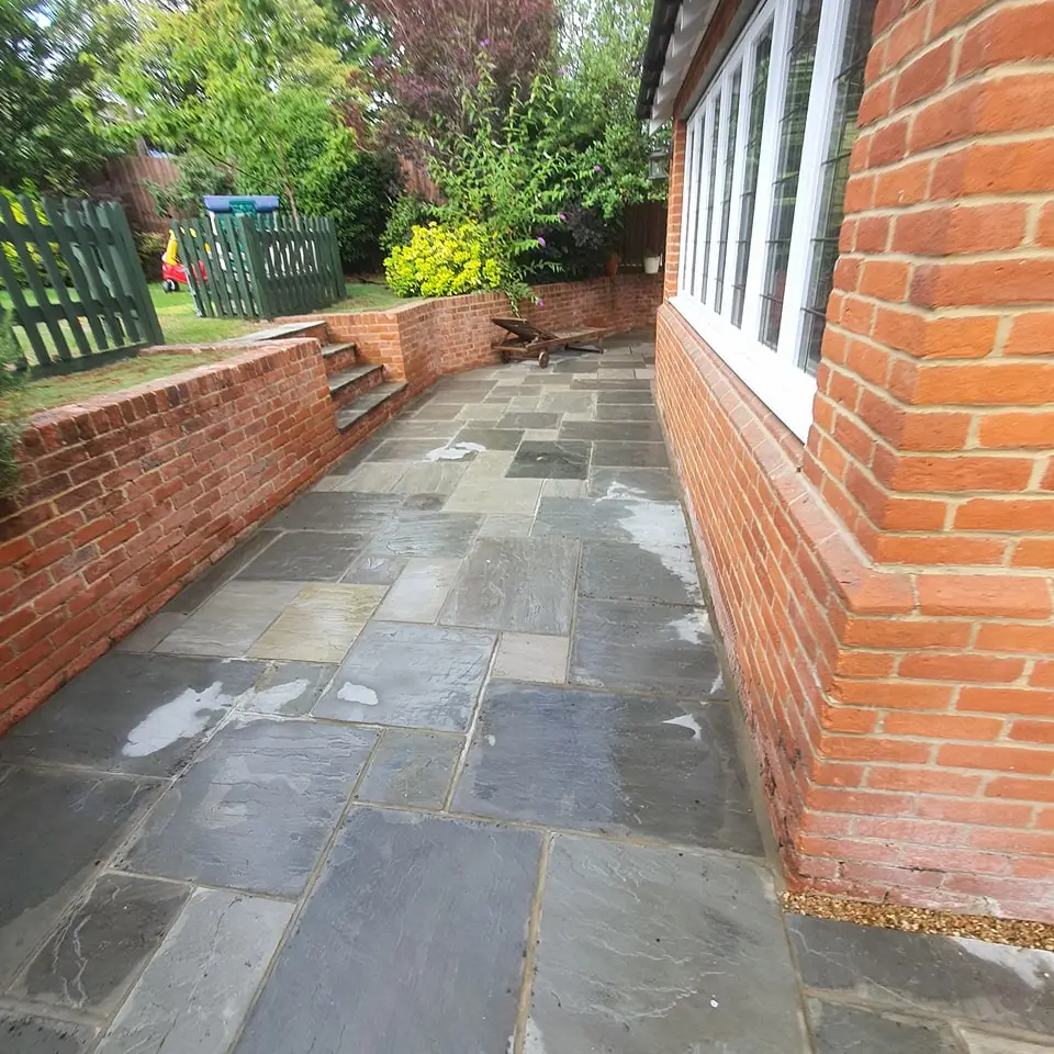 Garden redesign in Woking with raised beds and decorative paving