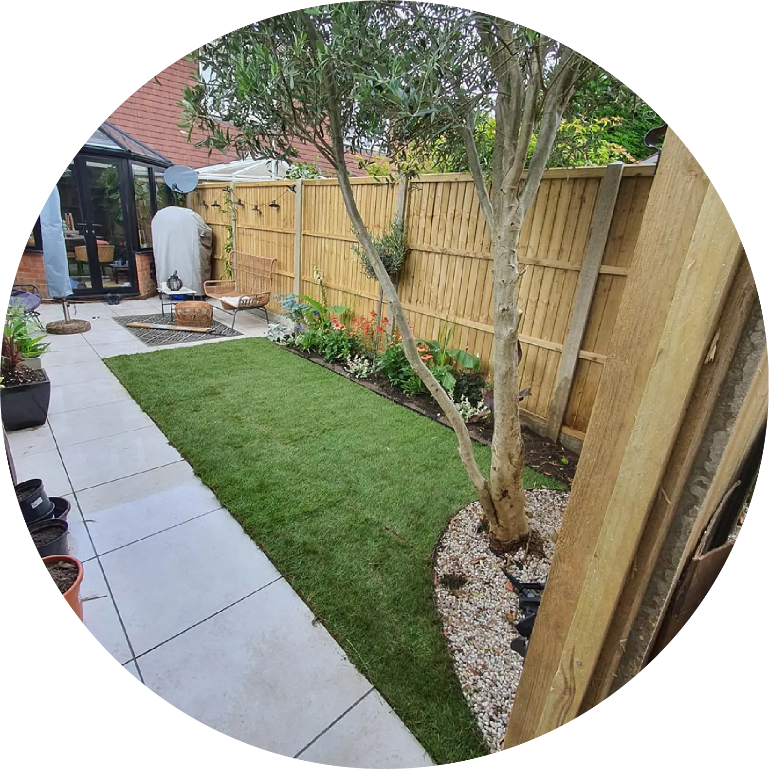 Garden patio in Woking with slabs being laid by Prestige Garden Maintenance team