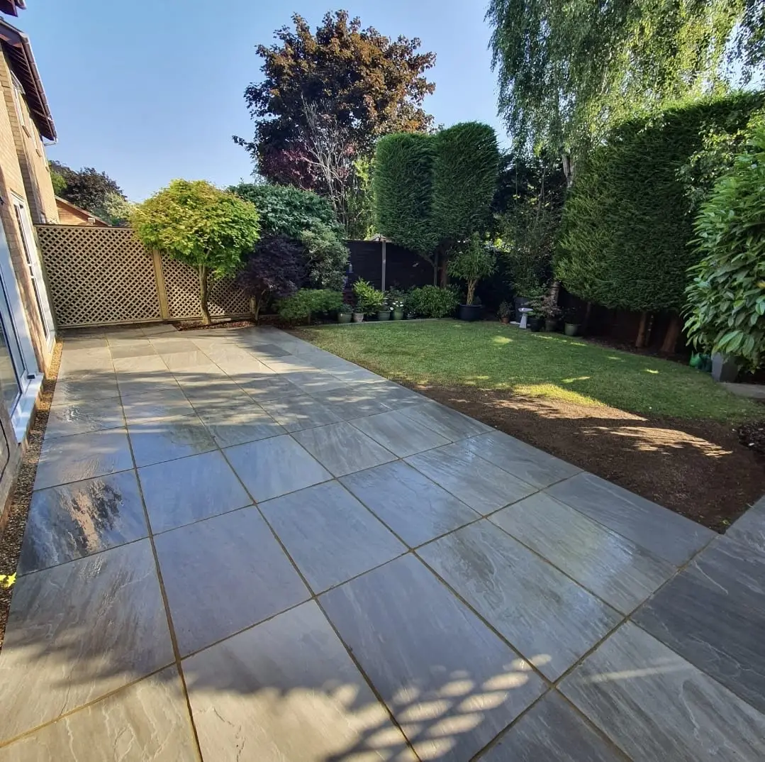 Professional patio builders in Woking installing a new outdoor living space