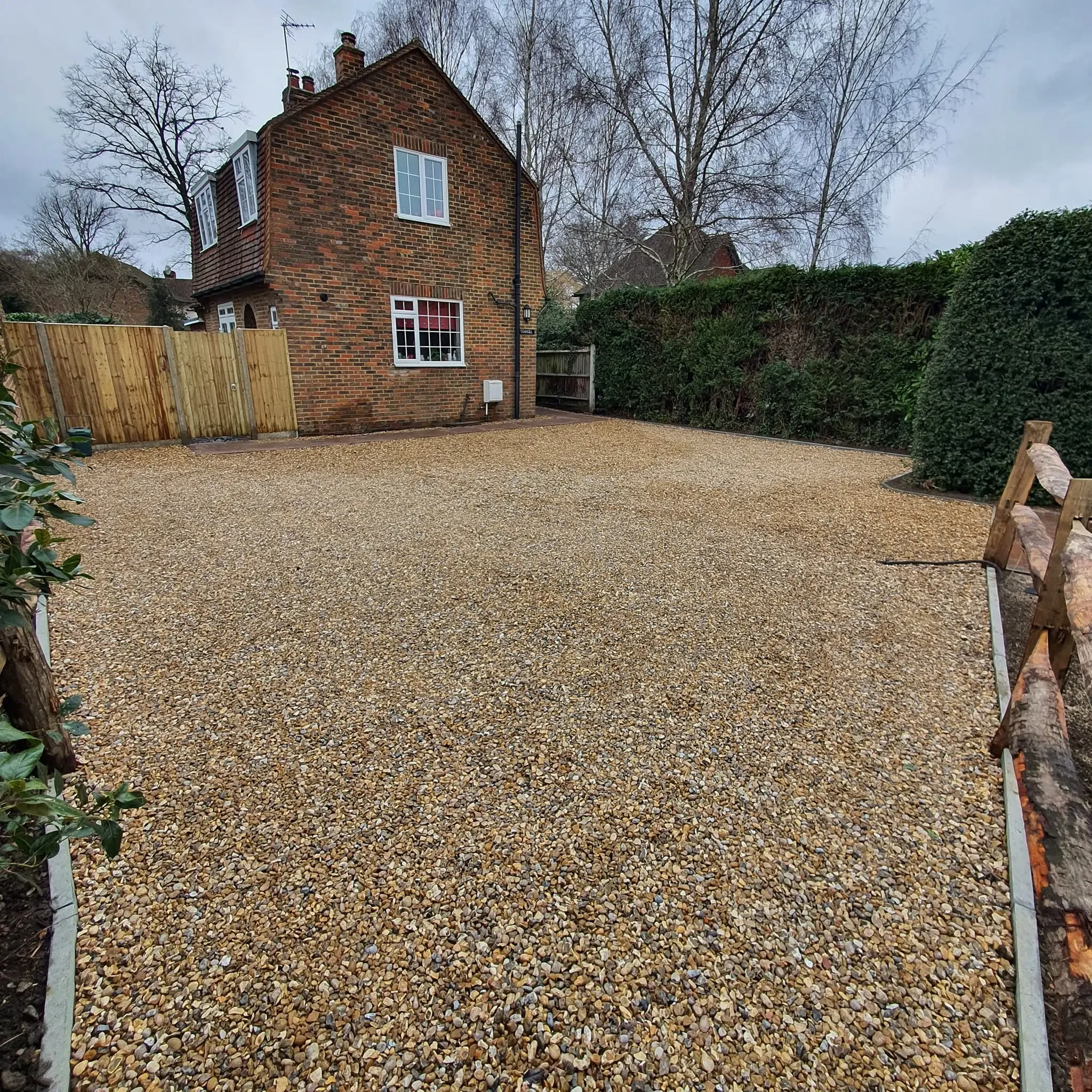 Pebble driveway installation in Woking by Prestige Garden Maintenance featuring a decorative and low-maintenance surface finish